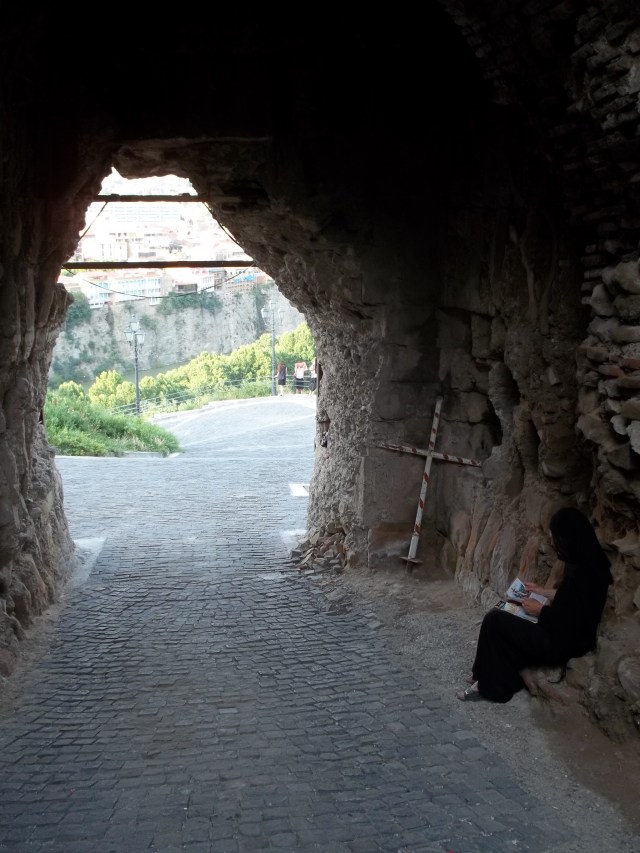 Lady Sitting inside the entrance to Narikala Fortress, Tbilisi