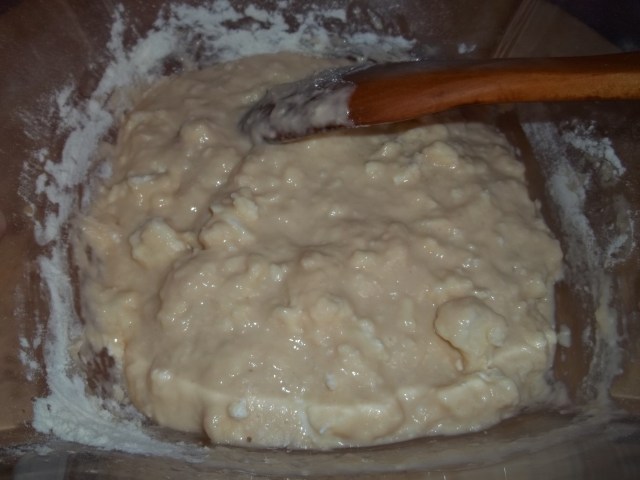 Adding imeretian cheese to make khachapuri dough