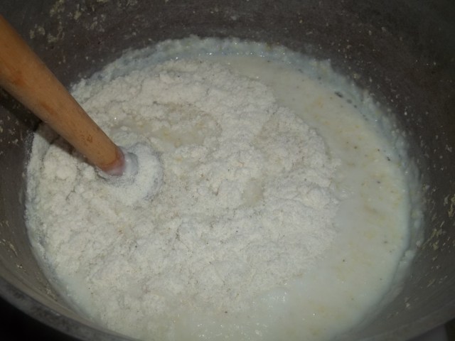 Stirring Cornflour and Cornmeal for Elarji Recipe