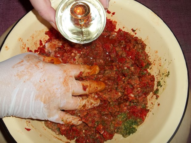 Adding Oil to the Ajika with Walnuts Mixture