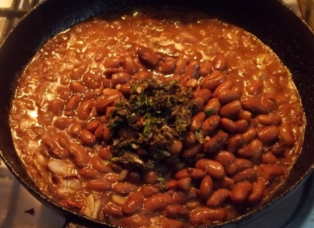 Adding Spices to Lobio with Mint and Eggs Recipe