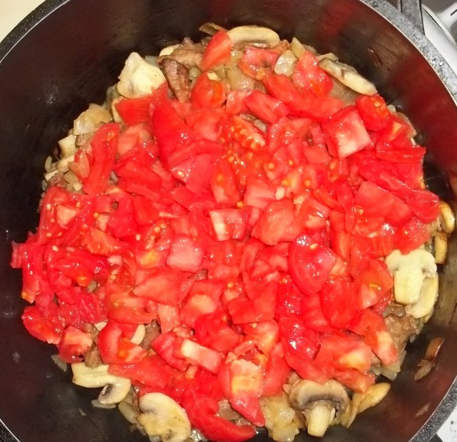 Adding Tomatoes for Pork Chashushuli with Mushrooms