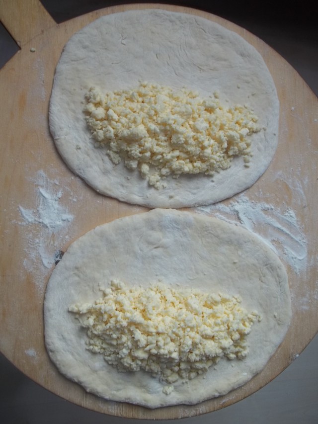 Cheese placed on Khachapuri Dough
