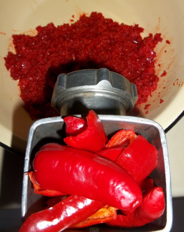 Crushing Red Peppers for Megrelian Ajika Recipe