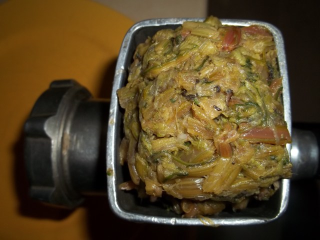 Grinding Squeezed Beetroot Stalks for Fkhali with Beetroot Leaves and Nuts Recipe