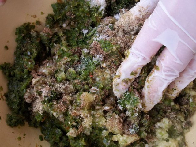 Hand Mixing Ingredients for Green Ajika
