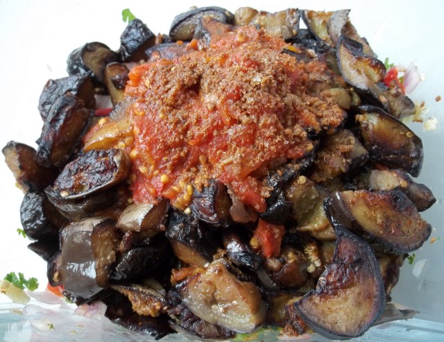 Adding Mixed Ingredients to Eggplant Recipe