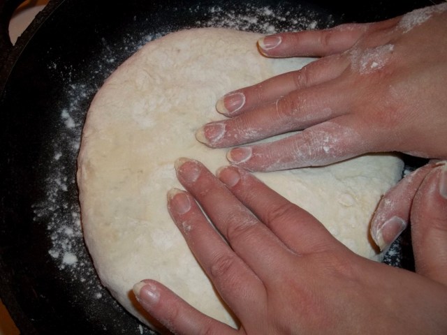 flattening-the-filled-dough-prior-to-cooking