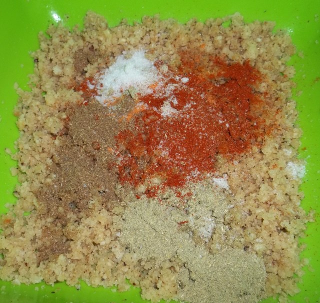 Spices and chopped garlic and nuts for Beetroot Fkhali with Nuts Recipe