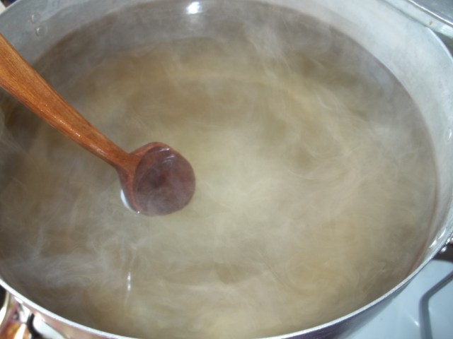 Stirring Sugar into Boiling Water for Pickled Walnuts Recipe