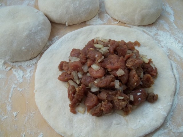 Adding Filling to Dough for Kubdari Recipe