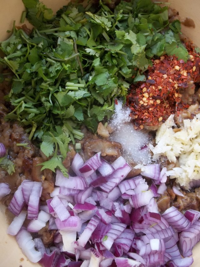 Adding Ingredients to Chopped Fried Eggplant