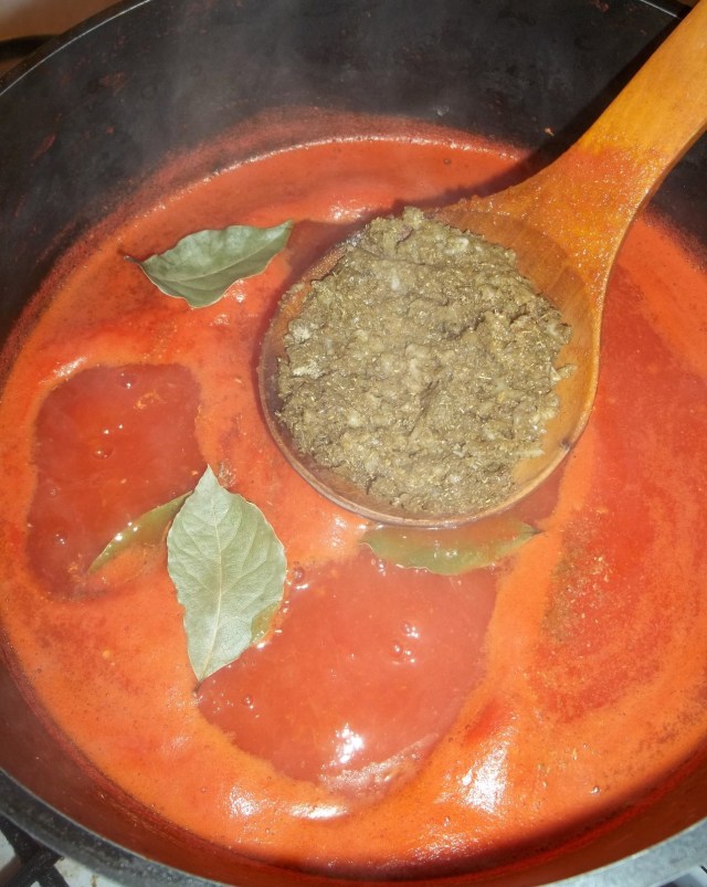 adding-ingredients-to-spicy-tomato-sauce-recipe