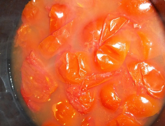 cooking-tomatoes-for-spicy-tomato-sauce-recipe
