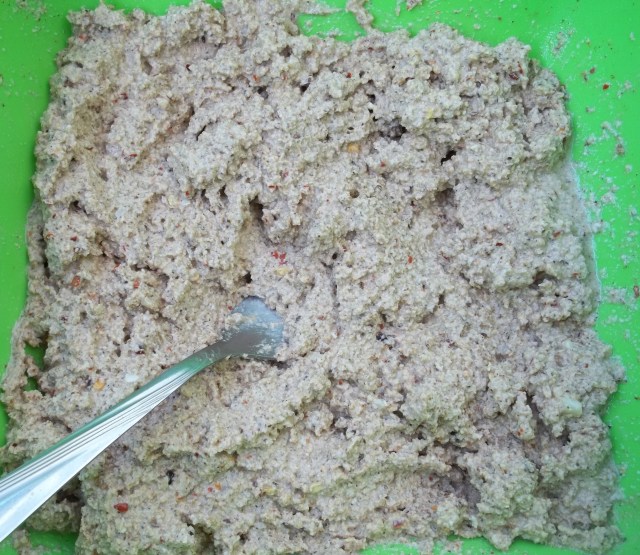 Mixing Spices and Walnuts for Shallot Satsivi Recipe