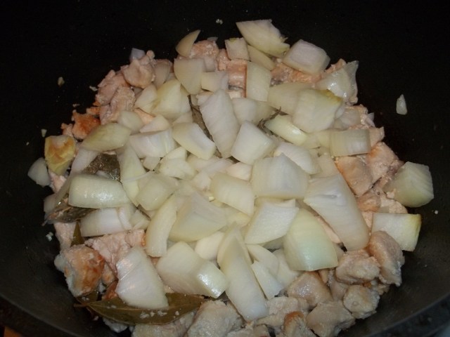 Adding Onions to Chicken for Chakhokhbili Recipe