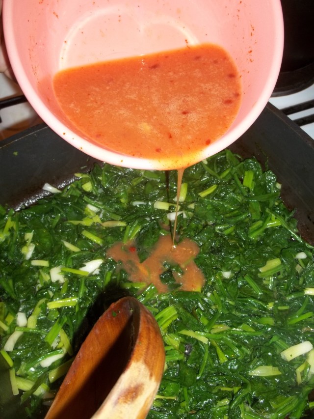 Adding the Egg Mixture to Spinach Parsley and Onions