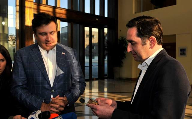 The President of Georgia presents a Bible decorated with precious stones to the National Center of Manuscripts.