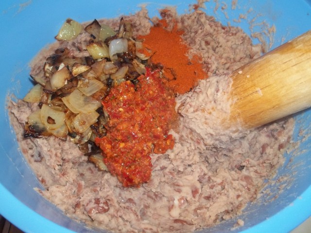 Adding Fried Onions and Ajika and Red Pepper to Lobio - Copy