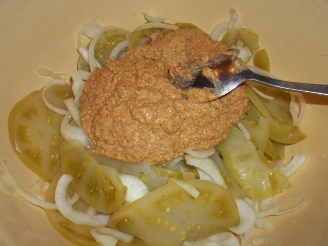 Adding Nut paste to onions and green tomatoes