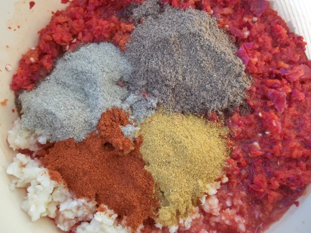 Adding Spices to Ground Peppers and Garlic