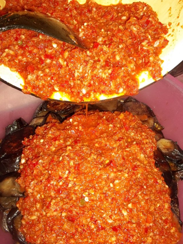 Adding the Mixture to Fried Eggplant