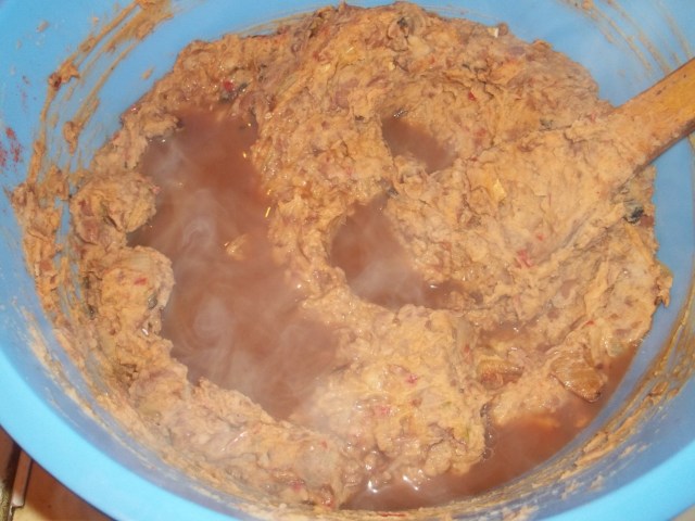 Stirring Ingredients for Lobio with Summer Savory and Ajika