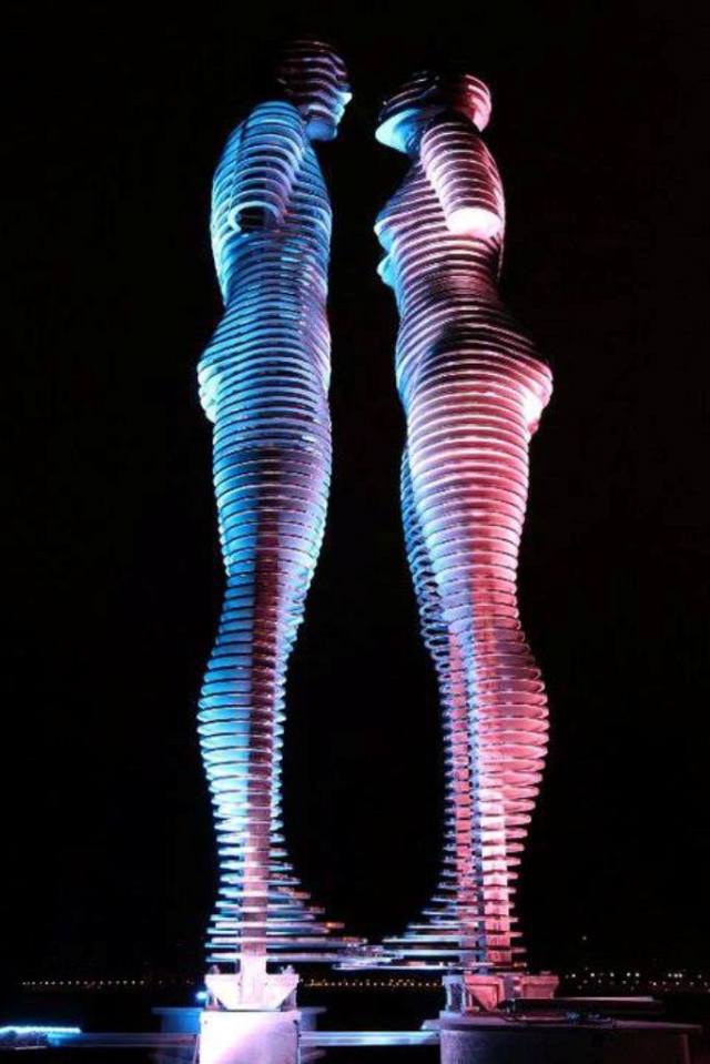 The Statue of Love in Miracle Park is illuminated at night