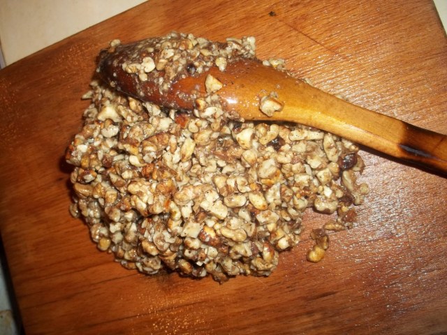 Adding Walnut Mixture to a Dampened Wooden Cutting Board - Copy