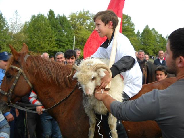 The winner of the horseriding competition with his prize