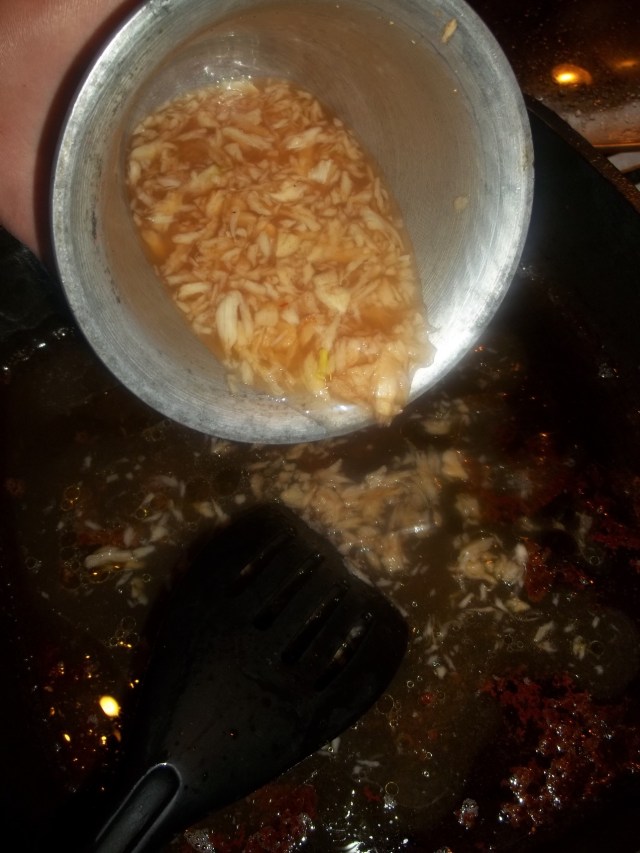 Adding Crushed Garlic to the oil used to fry chicken - Copy