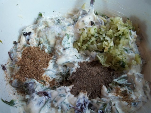 Adding Spices and crushed garlic and mint - Copy