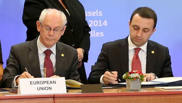 Georgian Prime Minister Irakli Garibashvili and Herman Van Rompuy President of the European Council Herman Van Rompuy signthe Association Agreement.