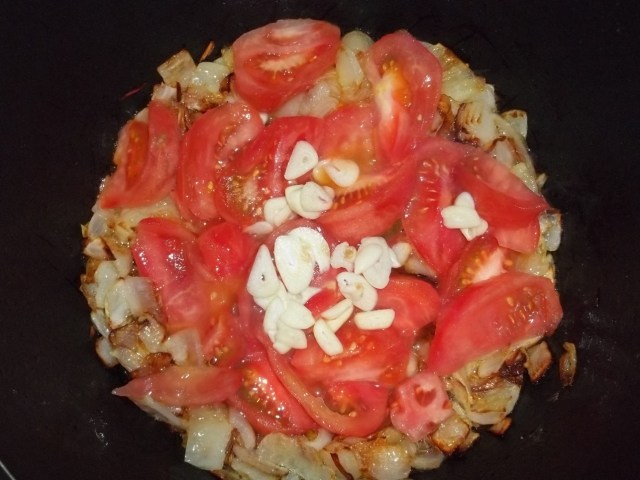 Adding Tomatoes and Garlic
