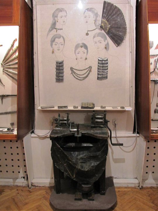 A display of jewelry and goldsmith machinery