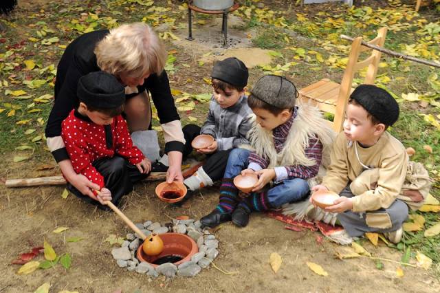 Celebrating with "wine" at the Kindergarten Autumn Festival in Tbilisi