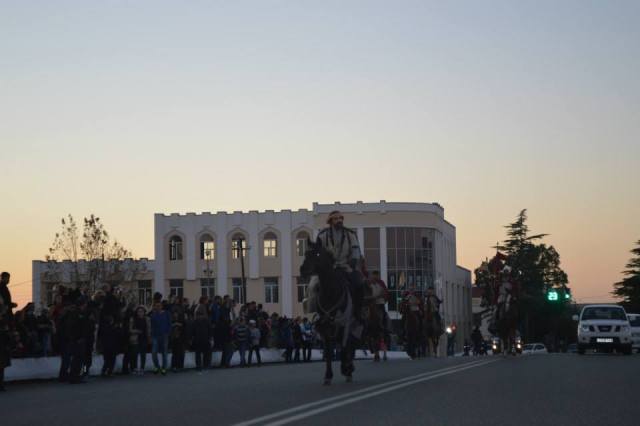 A rider portraying King Aeëtes rides through the city of Poti as part of the Pazisoba Festival. 