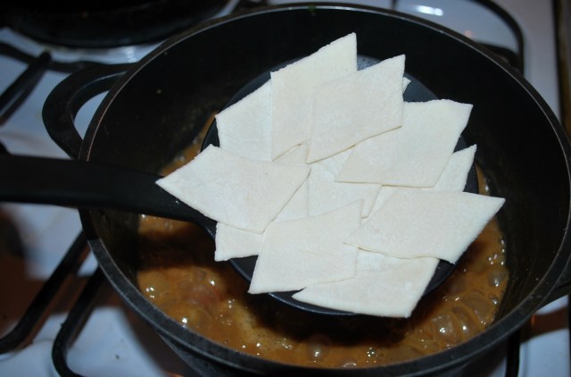 Adding the dough to the lobio