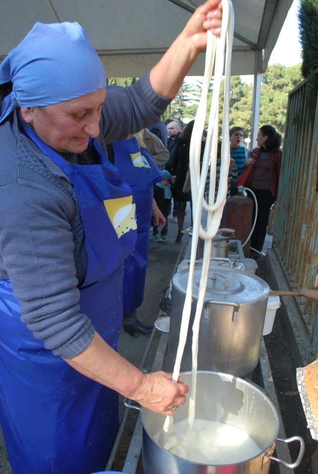 Stretched cheese is dipped in hot water to keep it pliable - Copy
