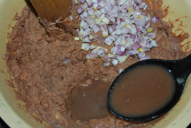Adding chopped onions and lobio water - Copy