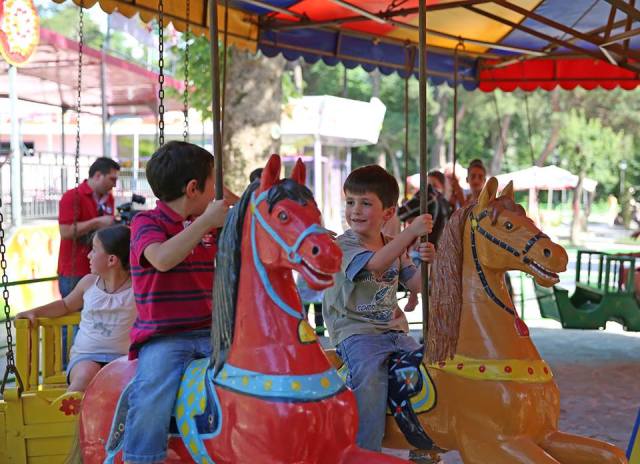 Children affected by the deadly flood in Tbilisi were treated to rides at Mushtaidi Park