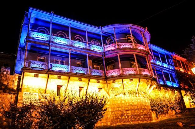 Illuminated balcony of a traditional building in Tbilisi_2