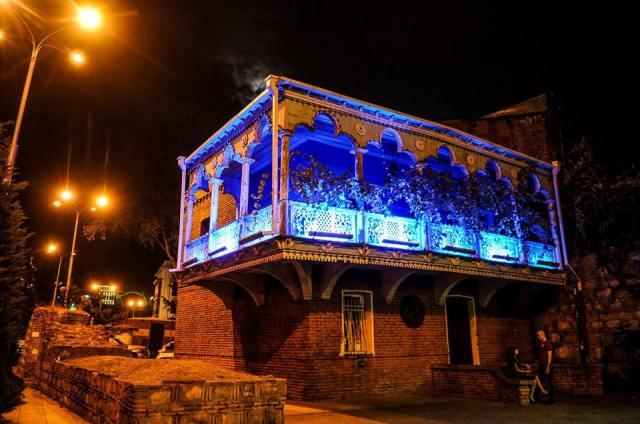Illuminated balcony of the 'Wedding House' building in Tbilisi